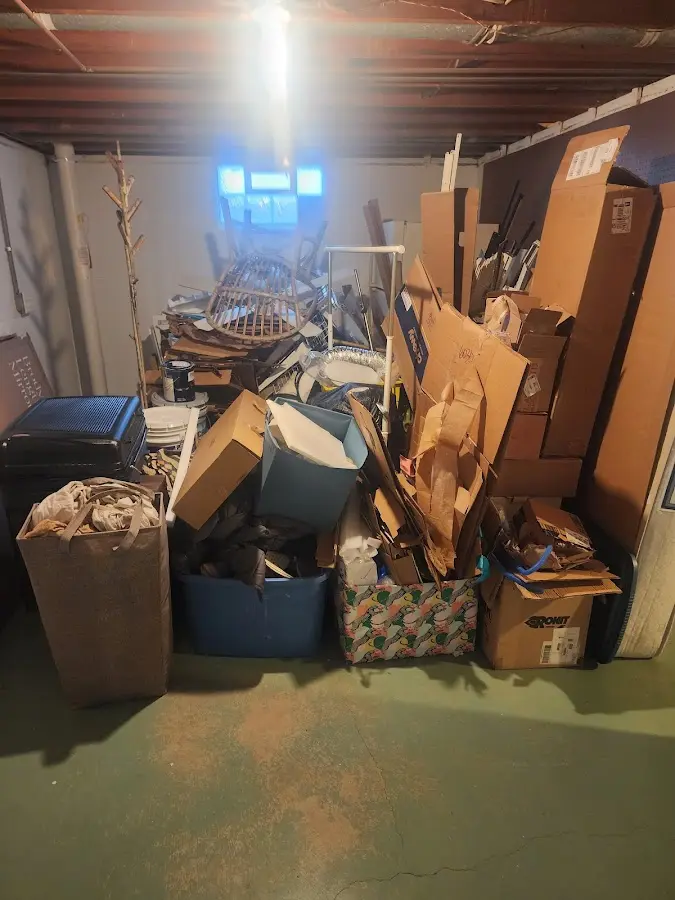 Roll-off dumpster container at job site for 2 Yard Dumpster Rental in August